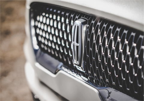 The grille of the 2023 Lincoln Aviator® Reserve model with an eye-catching repeated field of Lincoln Star logo shapes | Brinson Lincoln of Athens in Athens TX
