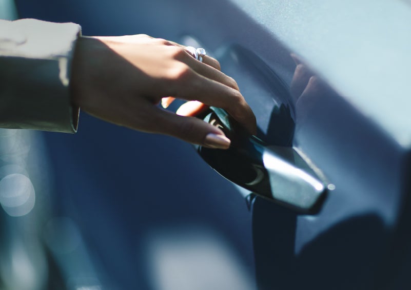A hand gracefully grips the Light Touch Handle of a 2024 Lincoln Aviator® SUV to demonstrate its ease of use | Brinson Lincoln of Athens in Athens TX
